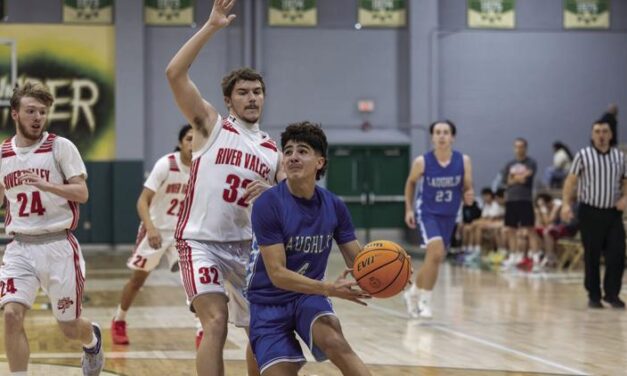 Laughlin boys basketball record first win in Holiday Basketball Shootout