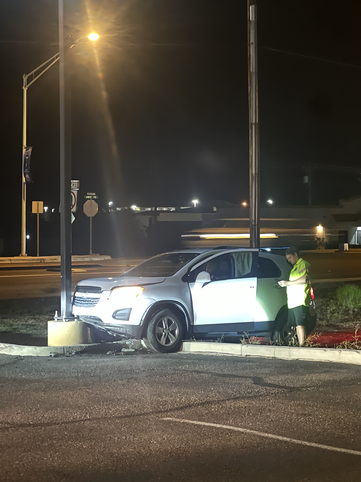 vehicle strikes light pole